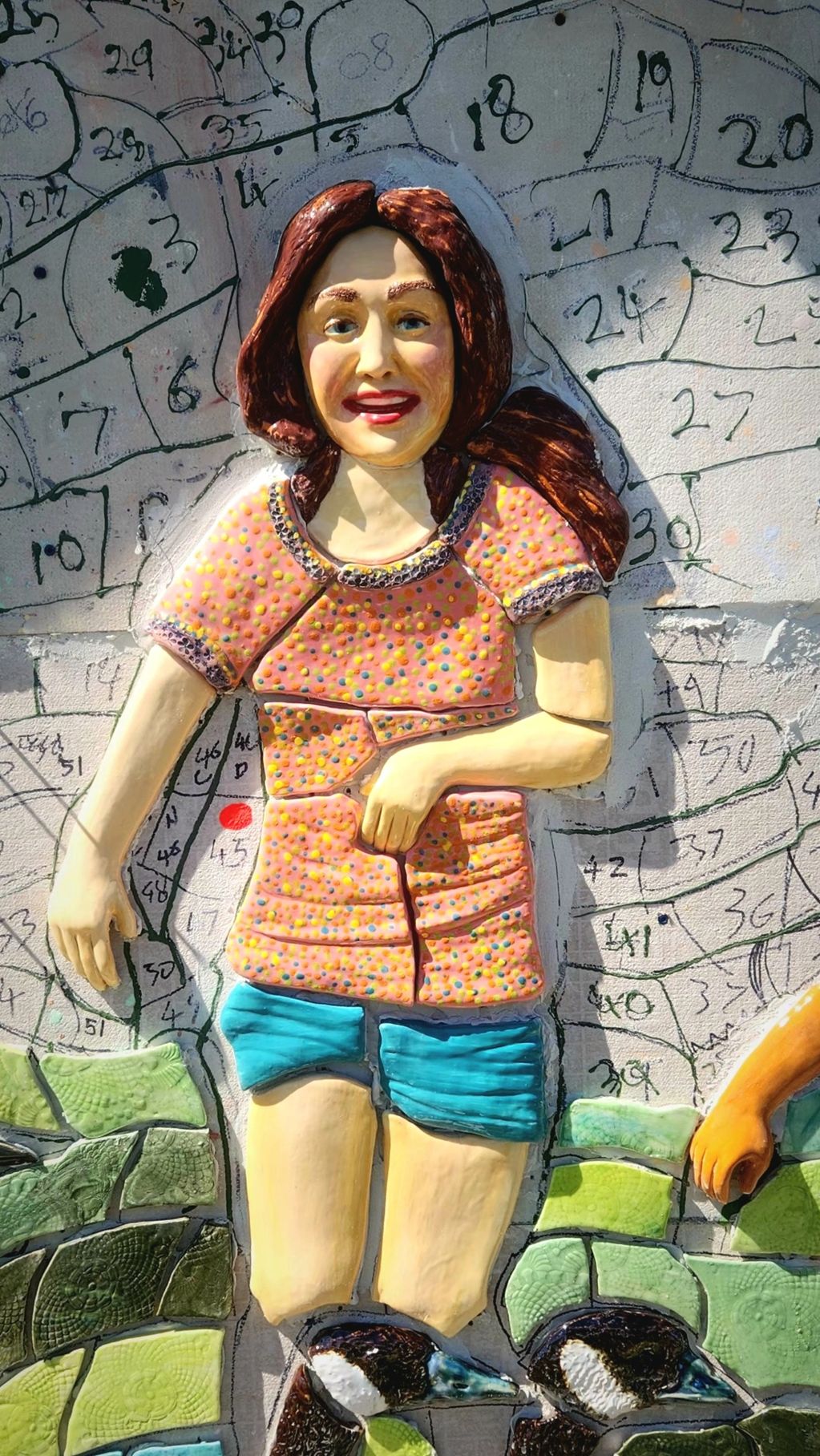 The first child I made. the tile has been mounted with cer
ment on the back board qhich is mounted t