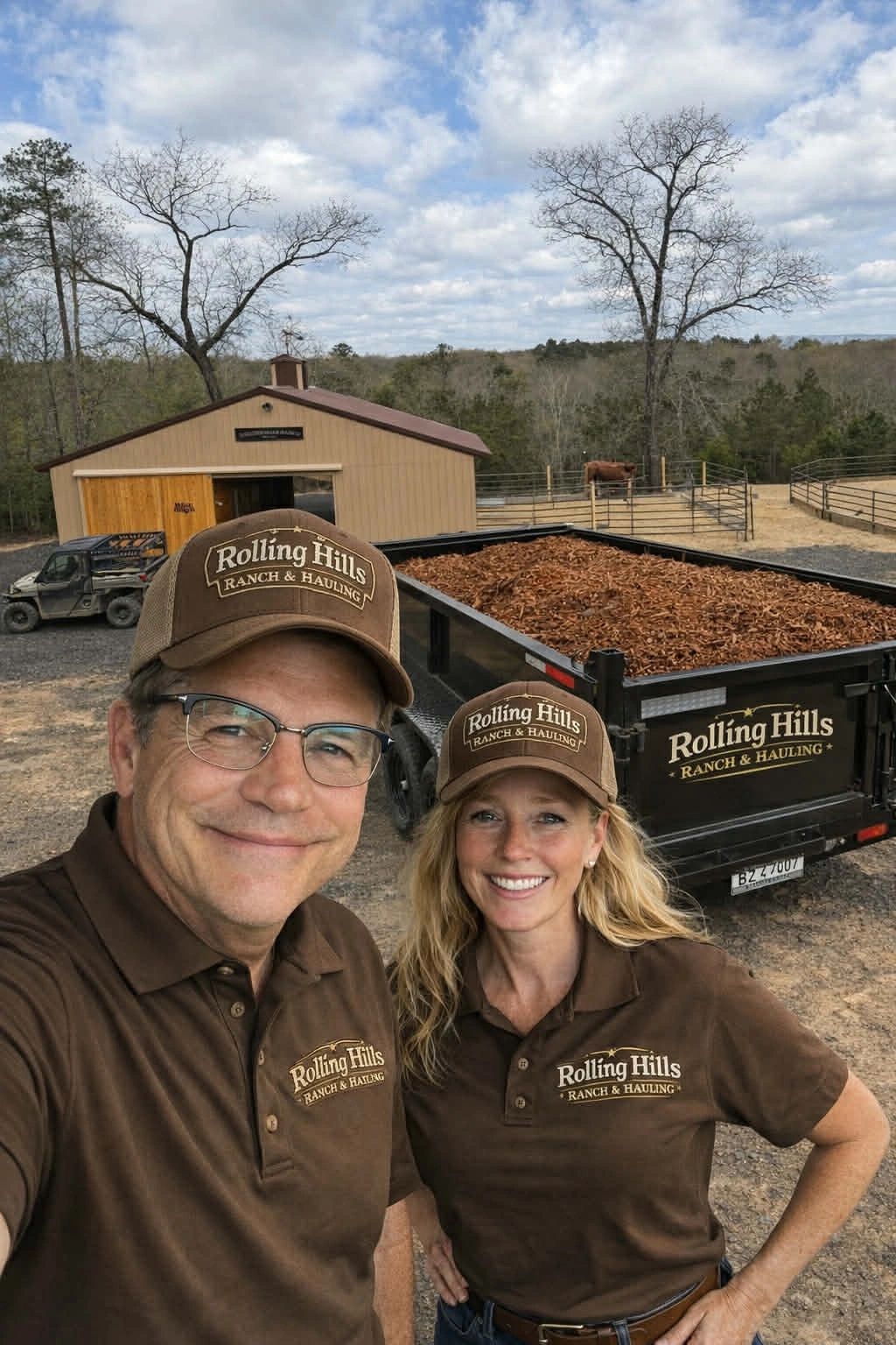 Us with dump trailer and barn