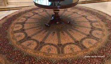 Exquisite Qom silk round hand knotted Persian carpet. 350 cms diameter. Color, Red, beige.