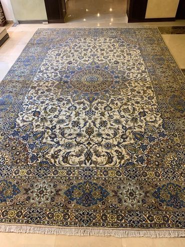 Kashan wool and silk handmade Persian carpet. Colors grey, cream with floral pattern and border.