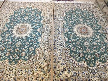 Pair of Nain Green and Beige Wool and silk Persian Carpets.