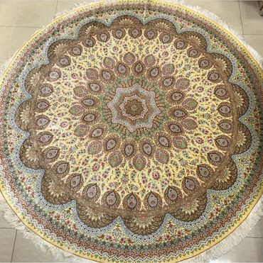 Qom silk round Persian rug. Gold and blue colour. 300 cms Diameter.