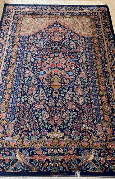Qom fine silk Persian carpet. Navy blue background with flowers and vase. Very intricate details. Si
