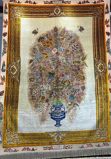 Persian carpet. Vase with tree of life flowers and butterflies. Signed rug.