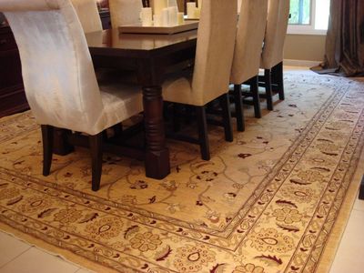 Handmade Afghan hand  knotted wool carpet. This is a Ziegler gold carpet used in the dining room. 