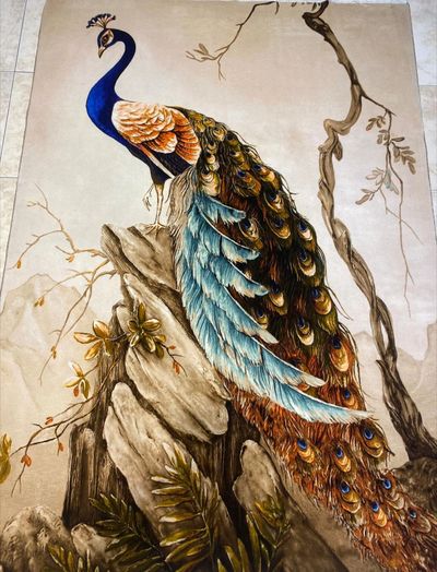 Luxurious Qom Silk Persian Carpet with beautiful image of a peacock. 