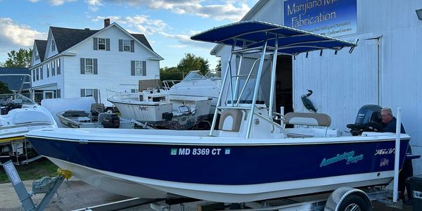 Blue and white boat on trailer at Maryland Marine Fabrication.