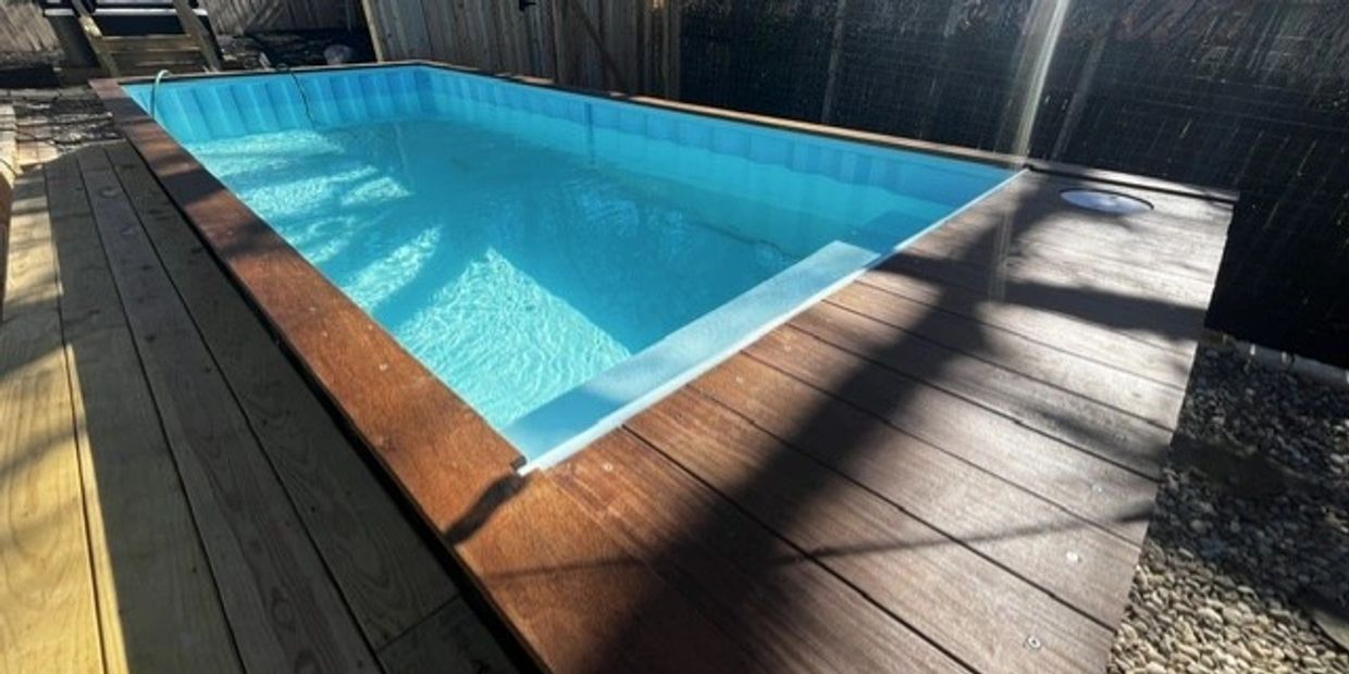 Custom shipping container pool with an integrated deck in Central Texas