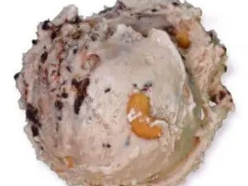 Scoop of ice cream with nuts and chocolate chunks.