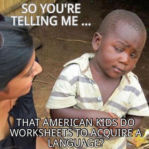Young African boy ask, "So you're telling me ... that American kids do worksheets to acquire a langu