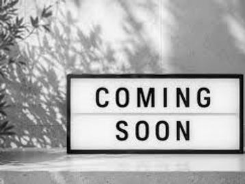 A lightbox sign reading 'COMING SOON'.