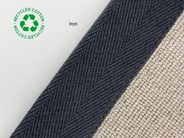 Close-up of recycled cotton fabric in iron color with texture details.