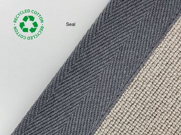 Close-up of textured fabrics labeled 'Seal' with recycled cotton logo.