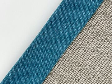Three fabric samples in white, cyan, and beige laid diagonally.