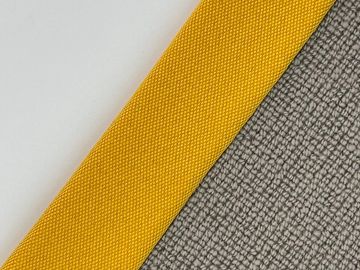 Close-up of fabric swatches in white, yellow, and gray colors with 'Glaze' label.