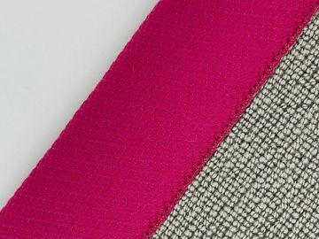 Close-up of textile textures with pink and grey fabrics.