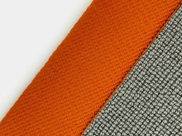 Close-up of orange and gray textured fabric.