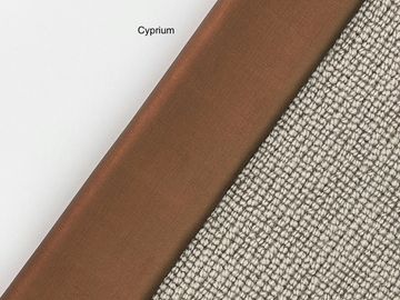 Close-up of three different fabric textures in white, brown, and beige colors.