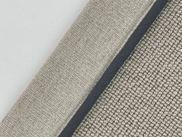 Close-up of textured fabric labeled 'Falcon' with a dark border.