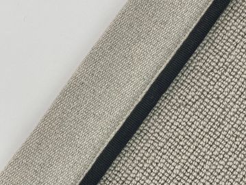 Close-up of textured fabric with a black trim and the word 'Midnight'.
