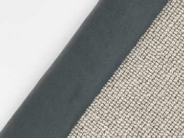 Close-up of two fabric textures, one smooth steel gray and the other a beige woven material.