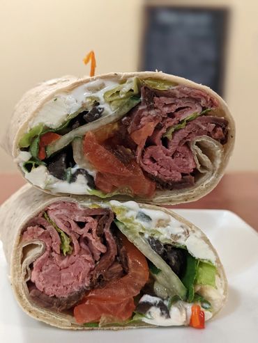 Veggie filled greek roast beef garlic herb wrap.