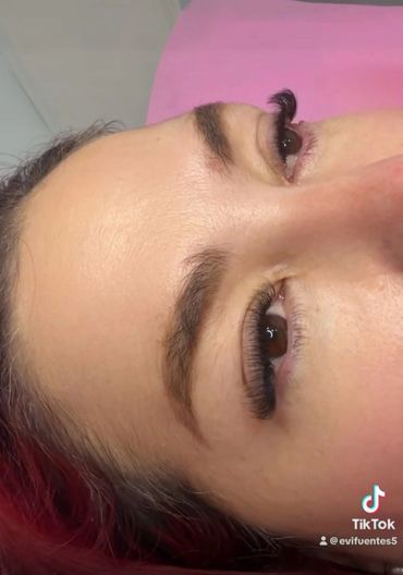 Close-up of a person's face focusing on eyes and eyelashes.