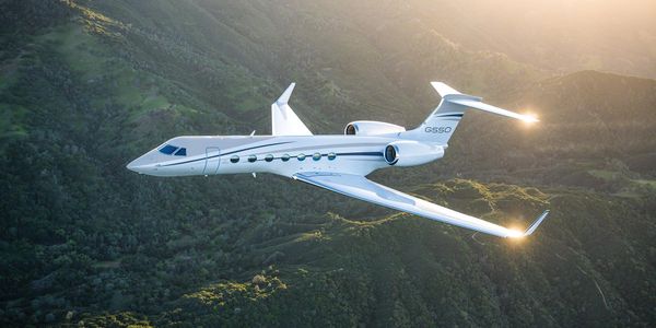 Fixed wing aircraft flying above mountain terrain
