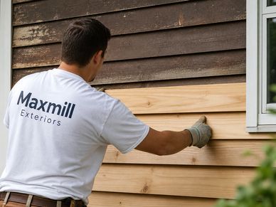 The worker replaced part of the damaged siding.