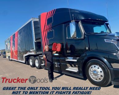 a man standing next to a semi truck, a stock photo by Doug Ohlson