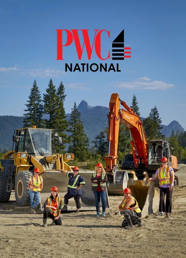 Multiple women standing in front of multiple heavy equipment.