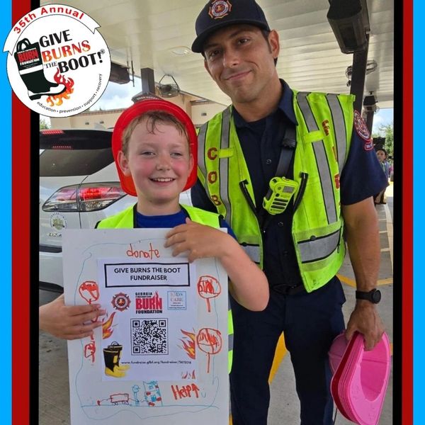 KIDS CARE Volunteers fundraising with Cobb County Fire Department for "Give Burns the Boot" Drive.