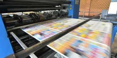 Printing press printing colorful sheet