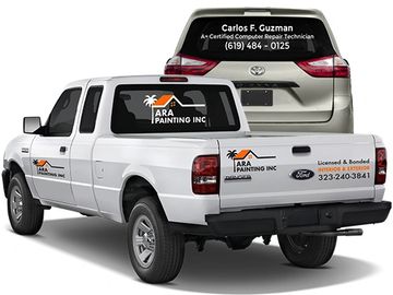 Vehicle Vinyl Cut Decals on rear window of SUV and on white pickup truck 