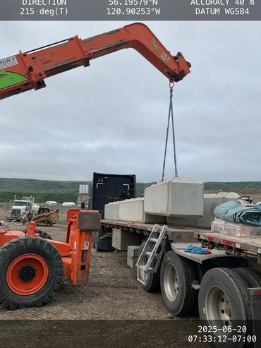 A bulldozer lifting cement brick