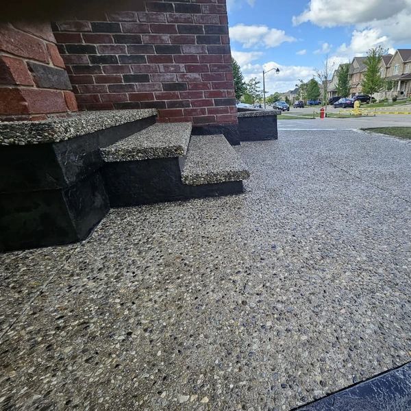 Exposed aggregate walkway & porch with a charcoal border