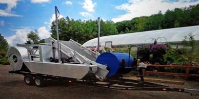 SM300 Eco-Harvester on Trailer in Front of Chain O' Lakes Home and Garden in Waupaca Wisconsin.