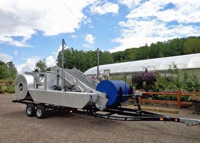 SM300 Eco-Harvester on Trailer in Front of Chain O' Lakes Home and Garden in Waupaca Wisconsin.