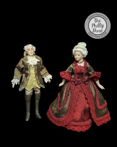 Vintage dolls dressed in 18th-century attire.