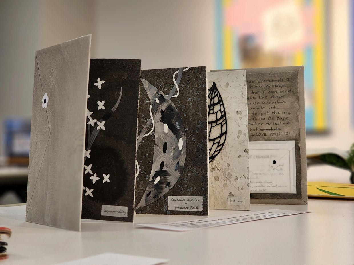 Decorative cards with botanical illustrations and handwritten notes.