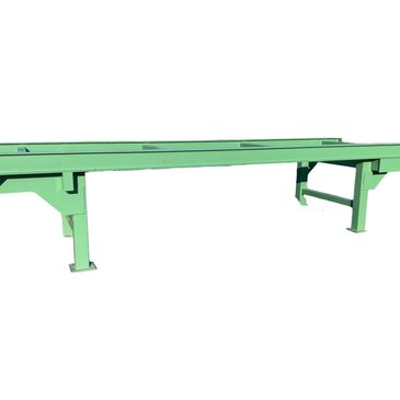 Green industrial metal conveyor frame with support legs.