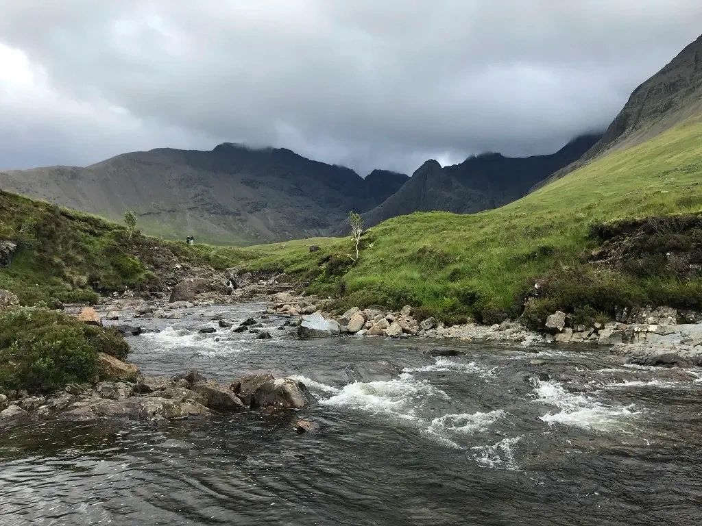 A clouded view of Bruach na Frìthe with Allt Coir' a' Tairneilear at the Fairy Pools on Skye, UK.