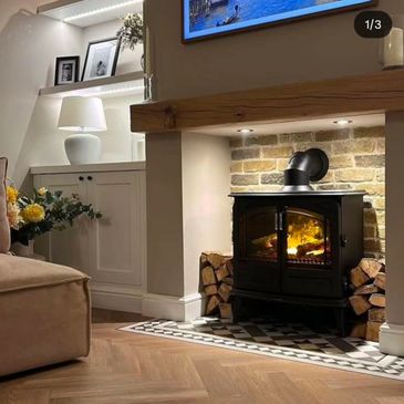 Cozy living room with a modern fireplace and warm lighting.