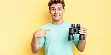 young man pointing at self
