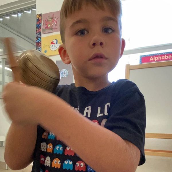 Child holding a sound bowl:)