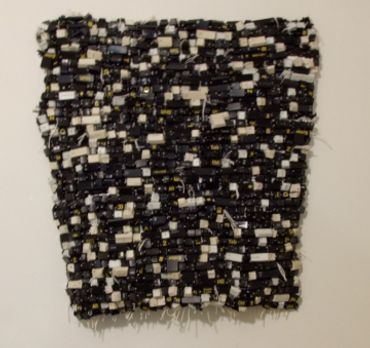 Square textile swatch with a black, white, and gray checkered pattern.