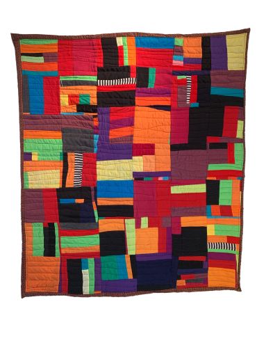 Abstract colorful patchwork quilt with geometric shapes.