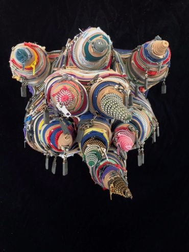 Colorful zippers arranged in cone shapes.