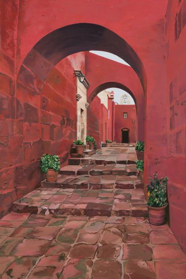 Sunlit red stone alley with arches and potted plants.