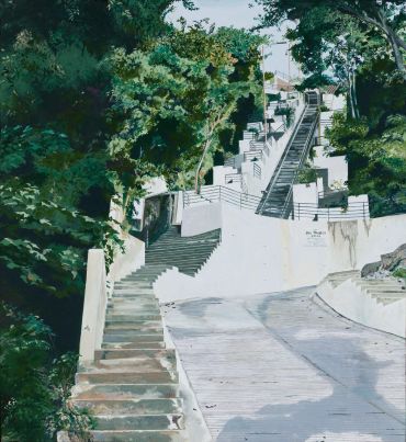 Steep outdoor staircase surrounded by trees.